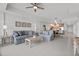 Open-concept living area with a view of the kitchen, neutral decor, and modern lighting at 415 Island Way # 303, Clearwater Beach, FL 33767