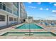 Large community pool and hot tub with waterfront views at 415 Island Way # 303, Clearwater Beach, FL 33767