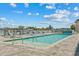 Community pool with lounge chairs and waterfront views at 415 Island Way # 303, Clearwater Beach, FL 33767