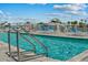 Community pool with sun loungers and waterfront views at 415 Island Way # 303, Clearwater Beach, FL 33767