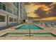 Community pool, hot tub and lounge area by the water at 415 Island Way # 303, Clearwater Beach, FL 33767