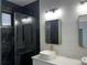 Modern bathroom featuring marble tile in the shower, and gold fixtures at 4241 E Palifox St, Tampa, FL 33610