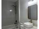 Tastefully designed bathroom with elegant vanity and a shower-tub combo with modern fixtures at 4241 E Palifox St, Tampa, FL 33610