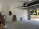 An empty garage with an automatic garage door at 4241 E Palifox St, Tampa, FL 33610