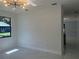 Minimalist living room featuring white walls, bright lighting, and expansive space ready for customization at 4241 E Palifox St, Tampa, FL 33610