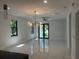 Bright living area with open floor plan, modern fixtures, and large windows, ideal for entertaining and relaxation at 4241 E Palifox St, Tampa, FL 33610
