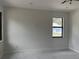 Unfurnished living room with large gray marbling floors and modern lighting, ready for new decor at 4241 E Palifox St, Tampa, FL 33610