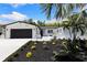 Charming painted brick home with modern landscaping and a two-car garage at 4618 Bayshore Ne Blvd, St Petersburg, FL 33703