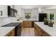 Kitchen boasts a stylish design with stainless steel appliances and modern white and wood cabinets at 4618 Bayshore Ne Blvd, St Petersburg, FL 33703