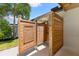 Outdoor shower featuring wood construction, offering a refreshing space after enjoying the pool or backyard at 4618 Bayshore Ne Blvd, St Petersburg, FL 33703