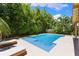 Beautiful pool with an expansive patio area with lounge chairs, creating a luxurious backyard oasis at 4618 Bayshore Ne Blvd, St Petersburg, FL 33703