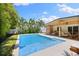 Well-maintained pool surrounded by lush greenery and an inviting covered patio area at 4618 Bayshore Ne Blvd, St Petersburg, FL 33703