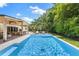 Backyard pool with a covered patio and chairs at 4618 Bayshore Ne Blvd, St Petersburg, FL 33703