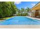 Sparkling pool with adjacent patio and landscaping for an idyllic backyard setting at 4618 Bayshore Ne Blvd, St Petersburg, FL 33703