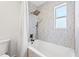 Bright bathroom features modern tile in the shower and tub enclosure at 4618 Bayshore Ne Blvd, St Petersburg, FL 33703