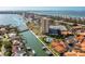Gorgeous aerial view of waterfront condo, parking, boat docks, canal, community pool, and surrounding community at 4900 Brittany S Dr # 209, St Petersburg, FL 33715