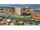 Stunning aerial view of waterfront condo building, community pool, boat docks, and beautiful landscaping at 4900 Brittany S Dr # 209, St Petersburg, FL 33715