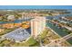 Aerial view of a waterfront community with a high-rise condominium building at 4900 Brittany S Dr # 209, St Petersburg, FL 33715
