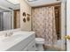 Clean bathroom with a tiled shower-tub combo, white sink, and vanity at 4900 Brittany S Dr # 209, St Petersburg, FL 33715