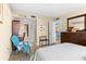 Comfortable bedroom with a desk area, closet, and calming decor at 4900 Brittany S Dr # 209, St Petersburg, FL 33715