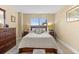 Inviting bedroom with a plush bed, bedside tables, and natural light creating a relaxing retreat at 4900 Brittany S Dr # 209, St Petersburg, FL 33715