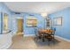 Well-lit dining area with an adjacent kitchen, offering a convenient space for meals and entertaining at 4900 Brittany S Dr # 209, St Petersburg, FL 33715