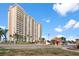 Beautiful high-rise condo with multiple balconies and a secured entry gate on a sunny day at 4900 Brittany S Dr # 209, St Petersburg, FL 33715