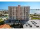Exterior of the waterfront condo showing canal access, parking, and lush landscaping at 4900 Brittany S Dr # 209, St Petersburg, FL 33715