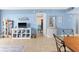 Open-concept living room featuring tile flooring, entertainment center and neutral wall color at 4900 Brittany S Dr # 209, St Petersburg, FL 33715