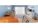 Comfortable living room with beach decor, a sofa, and plenty of natural light at 4900 Brittany S Dr # 209, St Petersburg, FL 33715