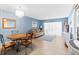 Living room featuring a table with chairs, couch, and beachy decor with natural lighting at 4900 Brittany S Dr # 209, St Petersburg, FL 33715