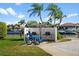 Outdoor grilling area with picnic tables and a view of the canal at 4900 Brittany S Dr # 209, St Petersburg, FL 33715