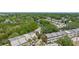 Aerial view of property including surrounding lush trees and river at 5435 Sweetwater Terrace Cir, Tampa, FL 33634