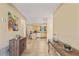 The hallway flows into an open kitchen and dining area with neutral tile flooring at 5435 Sweetwater Terrace Cir, Tampa, FL 33634