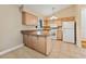 Efficient kitchen featuring neutral cabinets, countertops and white appliances at 5435 Sweetwater Terrace Cir, Tampa, FL 33634