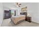 Comfortable main bedroom with a ceiling fan, a dresser, and a nightstand at 5435 Sweetwater Terrace Cir, Tampa, FL 33634