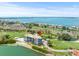 Stunning aerial view of a waterfront condo with golf course, offering luxury and leisure at 5700 Escondida S Blvd # 401, St Petersburg, FL 33715