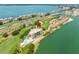 Scenic aerial of a waterfront condo near golf course, illustrating the perfect blend of recreation and relaxation at 5700 Escondida S Blvd # 401, St Petersburg, FL 33715