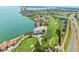 Breathtaking aerial of beachfront condo with golf course access, showcasing a resort-style lifestyle at 5700 Escondida S Blvd # 401, St Petersburg, FL 33715