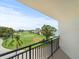Scenic balcony with views of the golf course, waterfront, and surrounding landscape at 5700 Escondida S Blvd # 401, St Petersburg, FL 33715
