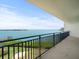 Balcony with scenic water views, green foliage, and a metal railing at 5700 Escondida S Blvd # 401, St Petersburg, FL 33715