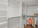 Walk-in closet with organized shelves and hanging storage at 5700 Escondida S Blvd # 401, St Petersburg, FL 33715