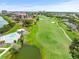 Aerial view of lush golf course in a waterfront community, offering golfers scenic and challenging play at 5700 Escondida S Blvd # 401, St Petersburg, FL 33715