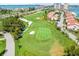 Aerial view of a golf course community with water views, offering a luxurious and active lifestyle at 5700 Escondida S Blvd # 401, St Petersburg, FL 33715