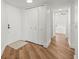Bright hallway featuring hardwood flooring, closet space and entrance to the bedroom at 5700 Escondida S Blvd # 401, St Petersburg, FL 33715