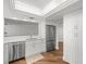 Bright kitchen with stainless steel appliances, a white countertop and white cabinets at 5700 Escondida S Blvd # 401, St Petersburg, FL 33715