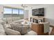 Modern living room with a comfortable seating arrangement and access to a water view from the balcony at 5700 Escondida S Blvd # 401, St Petersburg, FL 33715