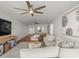 Spacious living room featuring hardwood floors, comfortable seating, and an opening into the dining area at 5700 Escondida S Blvd # 401, St Petersburg, FL 33715