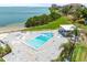 Aerial perspective of a pool under construction by the bay, promising a modern coastal living at 5700 Escondida S Blvd # 401, St Petersburg, FL 33715