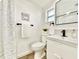 Bright bathroom with modern fixtures, stylish vanity, and fresh decor at 5703 Andrea Dr, Holiday, FL 34690